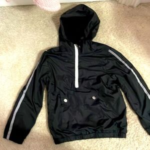A black jacket with white stripes and a white zipper
